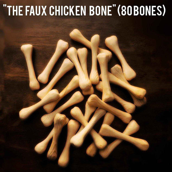 Pile of 80 faux chicken drum bones made from natural wood for realistic vegan drumsticks