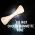 The Faux Chicken Drummette Bone wooden vegan meat alternative accessory on dark background